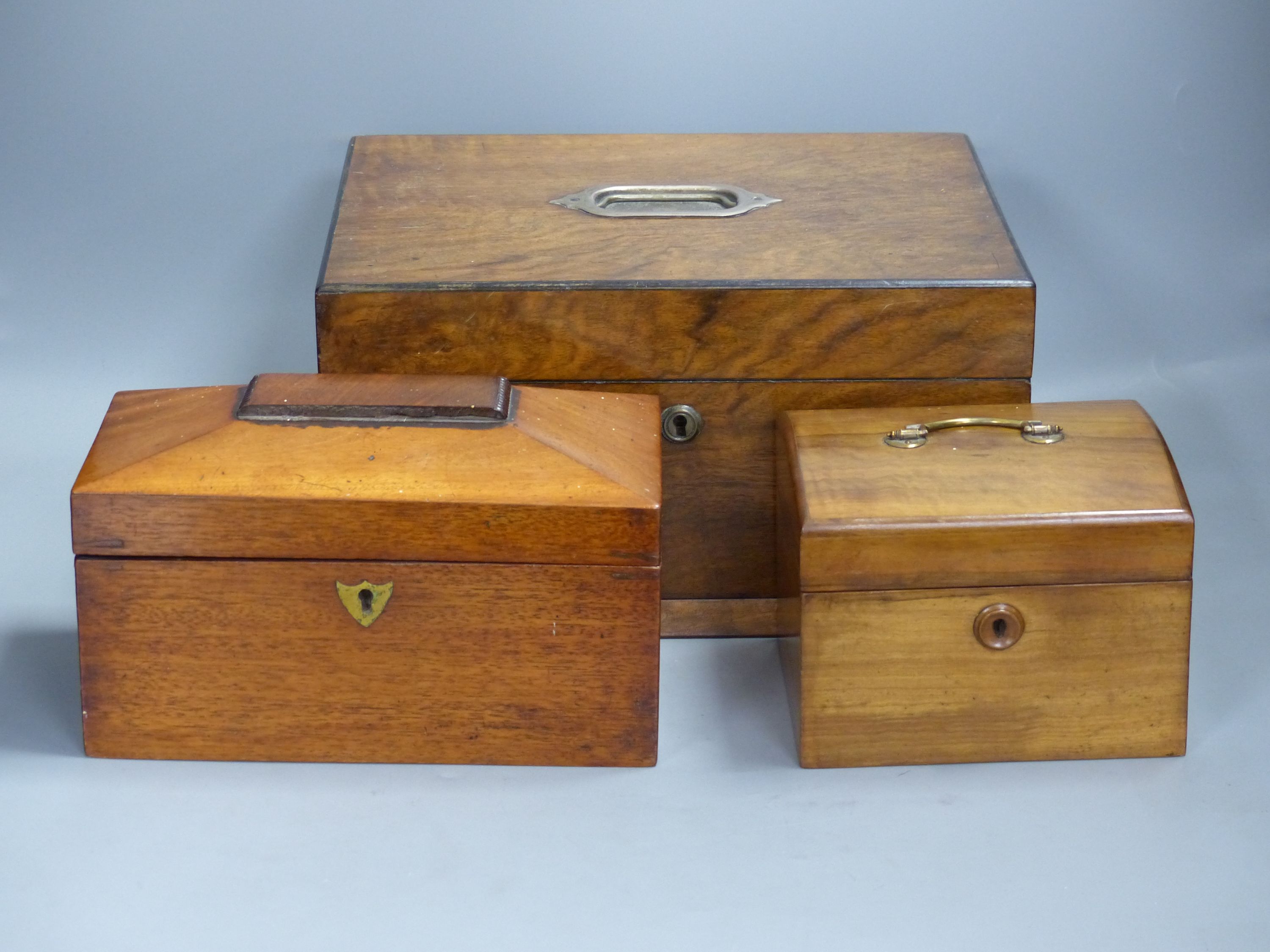 A Victorian walnut sewing box and two tea caddies (3)
